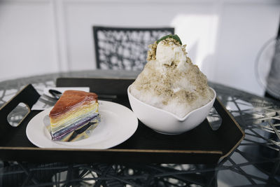 Close-up of ice cream served on table