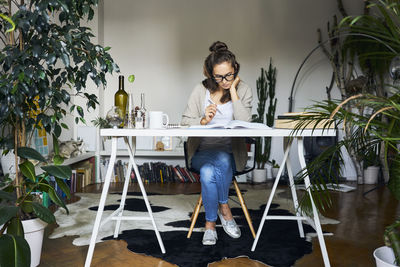 Woman sitting on table