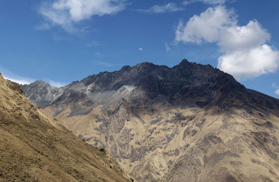 Scenic view of mountains against sky with moon