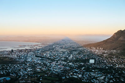 High angle view of buildings against sky at sunset