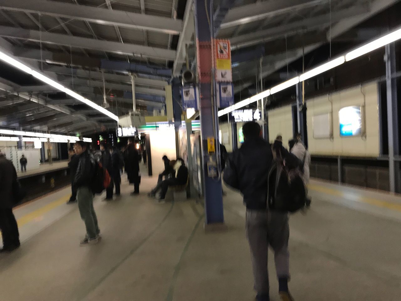 real people, railroad station platform, railroad station, men, walking, transportation, large group of people, illuminated, indoors, public transportation, full length, train - vehicle, women, architecture, lifestyles, built structure, day, people