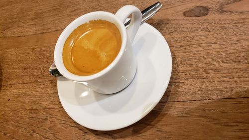 High angle view of coffee cup on table