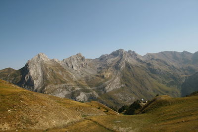 Scenic view of mountains against clear blue sky