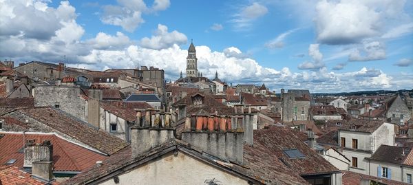 Buildings in town against sky