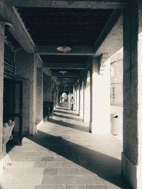 Man walking in corridor of building