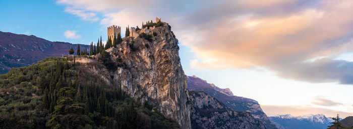 Arco castle on rocky cliff horizontal background of trentino alto adige - trento - italy landmarks .