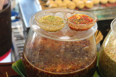Close-up of beer in glass container on table