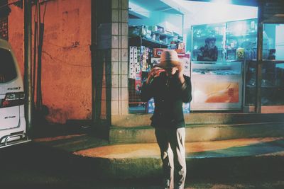 Rear view of man walking in building