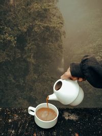 Girl holding coffee cup