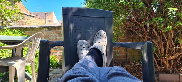 Low section of person relaxing in park