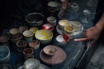 High angle view of people preparing food on table