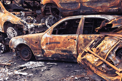 Abandoned car on field