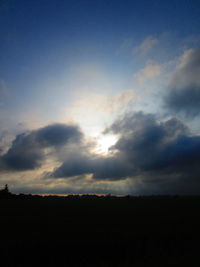 Low angle view of silhouette landscape against sky during sunset