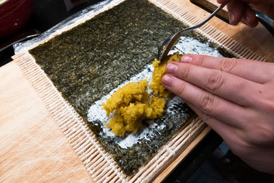 High angle view of person preparing food