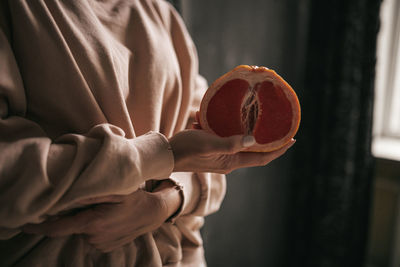 Close-up of hand holding fruit