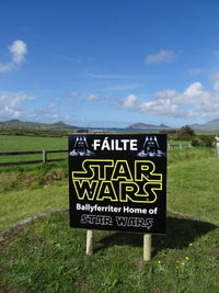 Information sign on grassy field