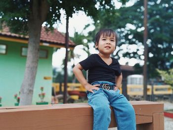 Portrait of boy sitting outdoors