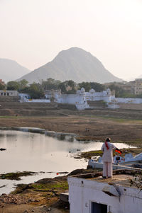 Calm sea with mountain range in background