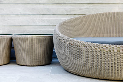 Close-up of chairs on tiled floor