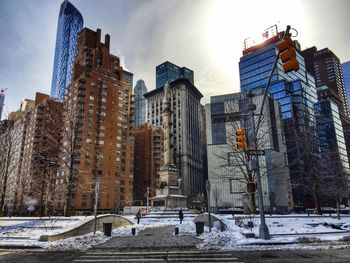 Snow covered buildings in city