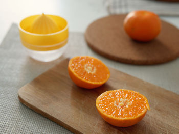 Close-up of orange slices on cutting board