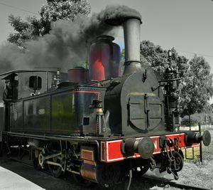 Train on railroad track against sky