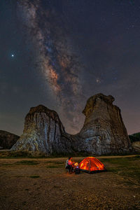 Scenic view of tent against milky sky at night