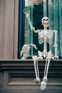 Low angle view of man and window