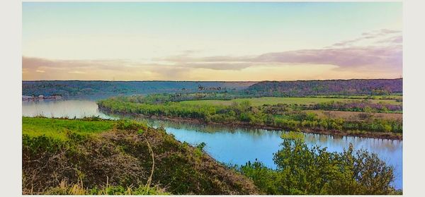 Scenic view of landscape against cloudy sky