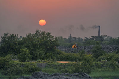 Brick field chimney, at taki in west bengal, near ichamati riverbank. photo taken during sunset.