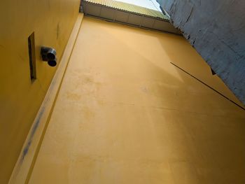 Low angle view of yellow door of building