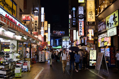 People on city street at night