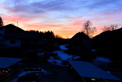 Houses against sky during winter