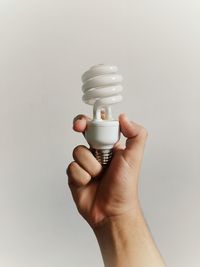 Cropped hand of person holding medicine