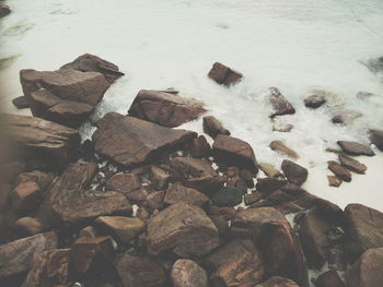 High angle view of rocks by river