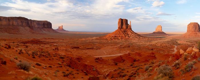 View of rock formations against cloudy sky