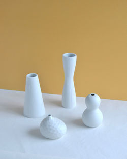 Close-up of white vases on table