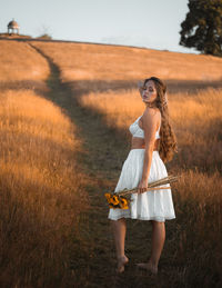 Full length of woman on field