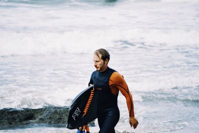 Full length of man standing on beach