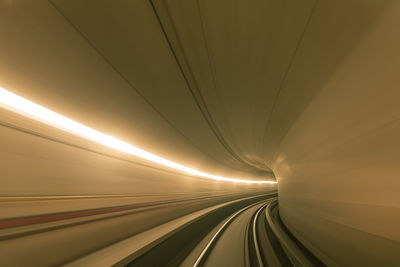 Light trails in illuminated tunnel