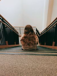 My daughter sitting on the stairs