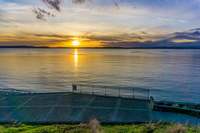 A walkway and sunset in west seattle, washington.