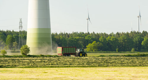 Tractor harvesting grass for the animal forage