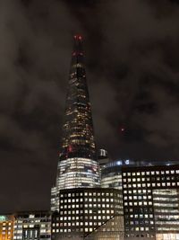 Illuminated modern buildings in city at night