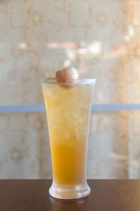 Close-up of drink on glass table