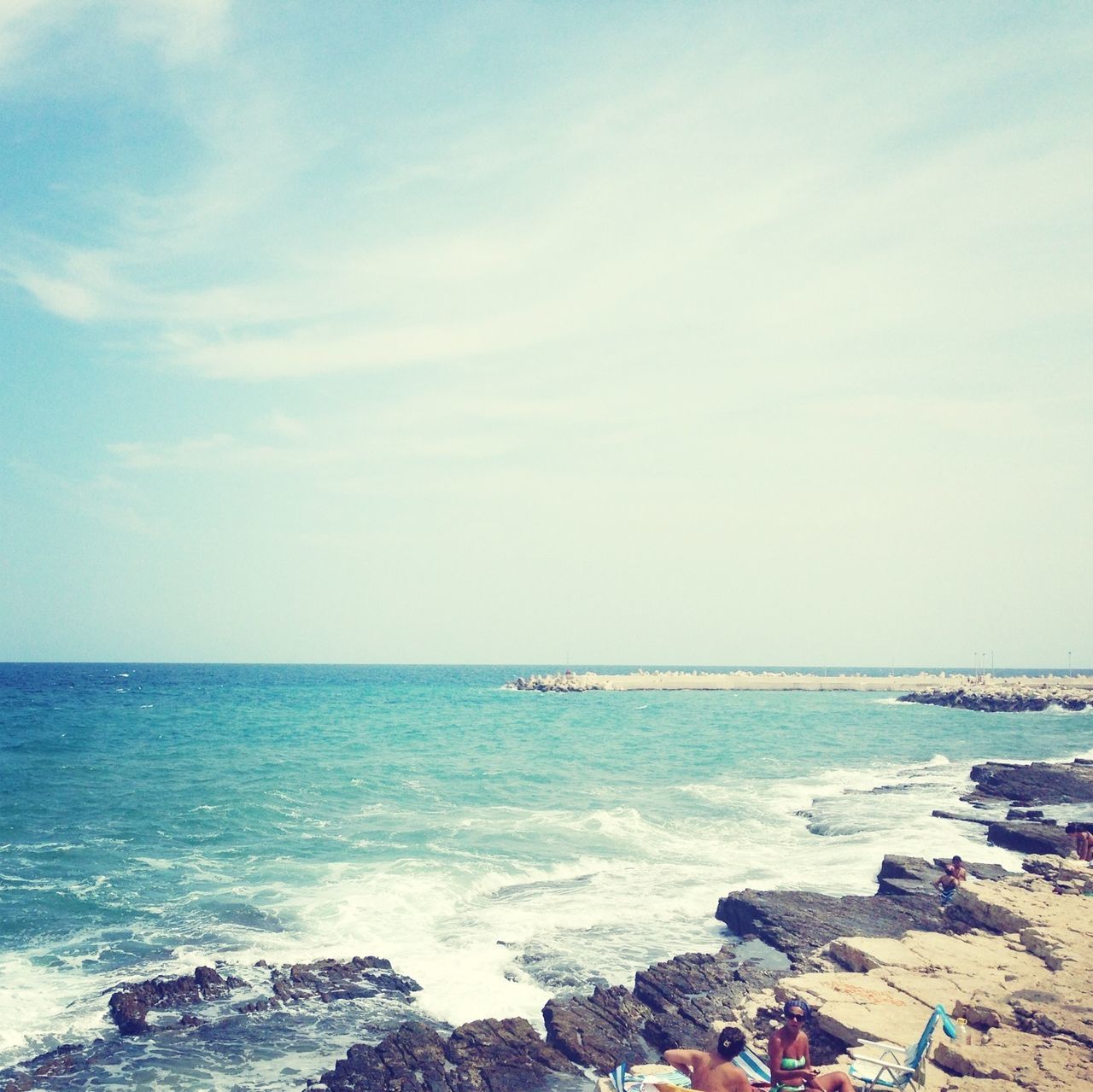 sea, horizon over water, water, beach, sky, shore, scenics, rock - object, beauty in nature, tranquil scene, tranquility, nature, blue, wave, idyllic, day, cloud - sky, outdoors, surf, coastline