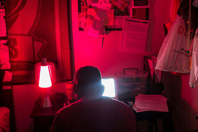 Woman working in illuminated room