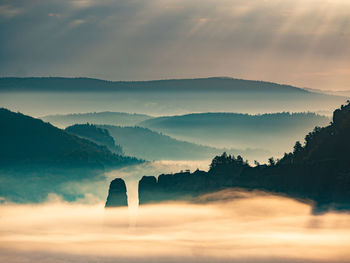 Scenic view of mountains against sky during sunset