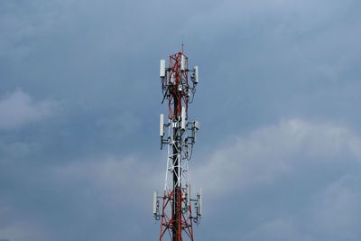 Low angle view of tower against cloudy sky