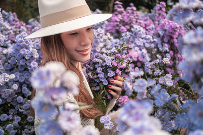 Portrait of woman with pink flowers